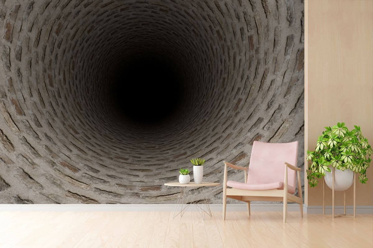 3D Realistic Gray Brick Tunnel Mural Wallpaper shown in a room