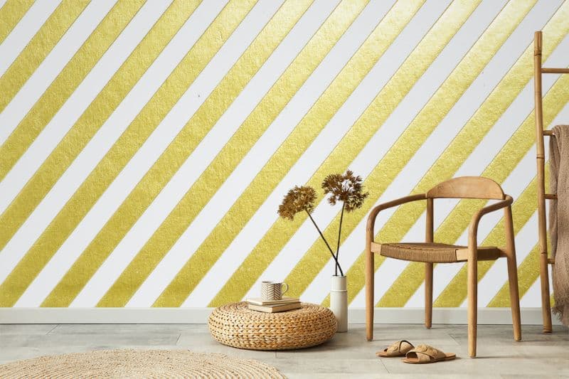 Golden Glamour Stripes Wallpaper Mural shown in a room