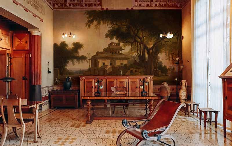Vintage Village Painting Wallpaper Mural shown in a room