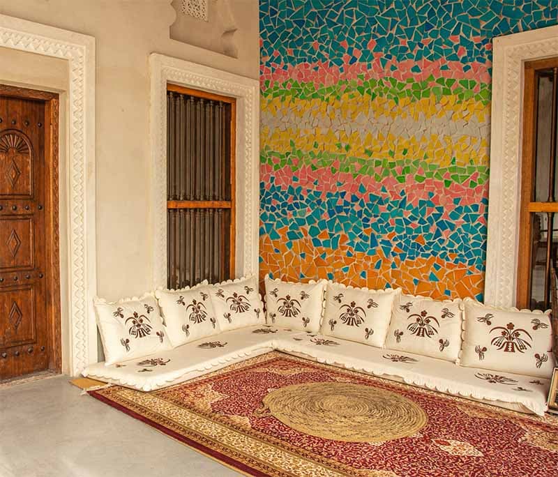 Colorful Mosaic Harmony Mural Wallpaper shown in a room