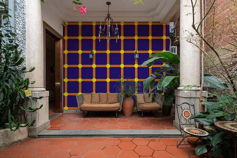 Blinking Optical Dots Illusion Wallpaper Mural shown in a room
