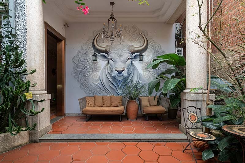 Elegant Bull Head Sculpture Wallpaper Mural shown in a room