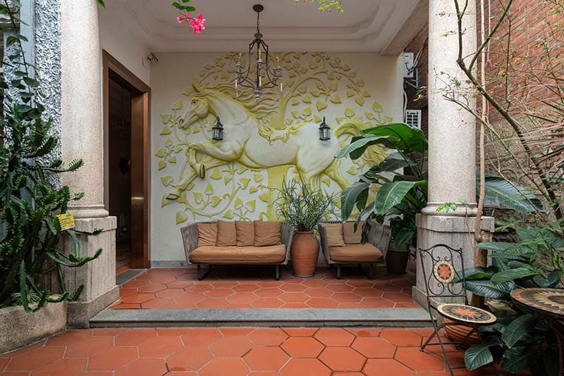 Elegant Horse Stone Carving Wallpaper Mural shown in a room