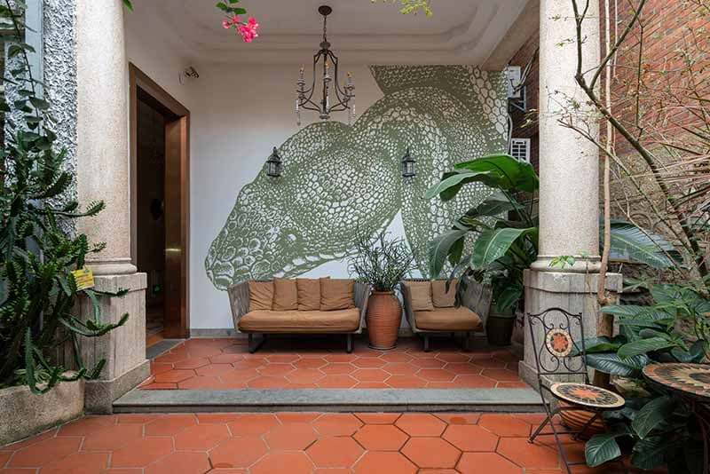 Green Boa Amazon Forest Wallpaper Mural shown in a room