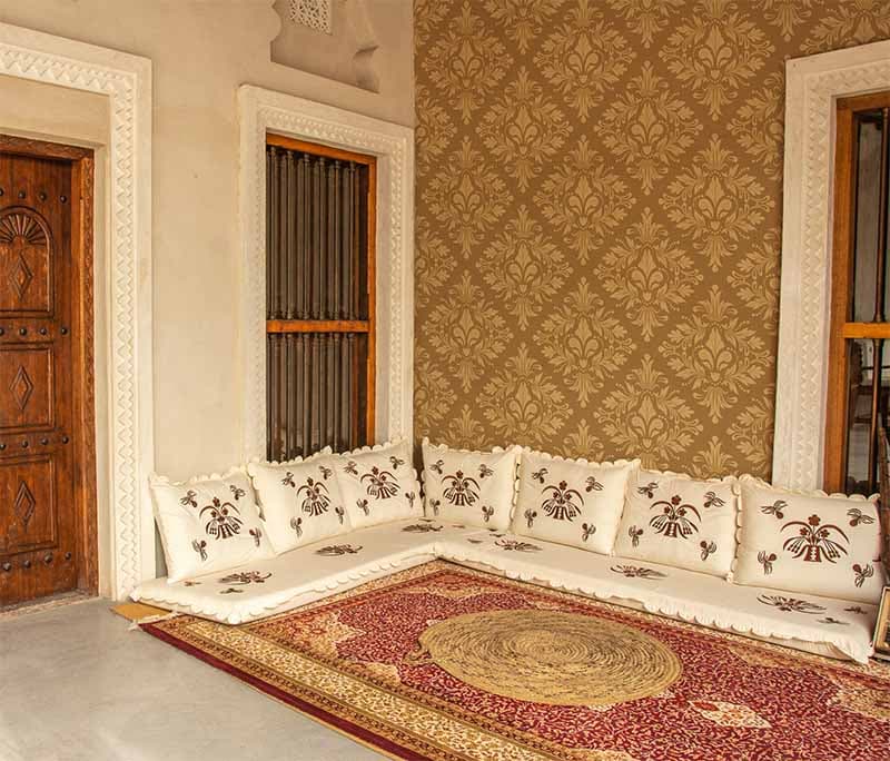 Empire Gold Flourish Damask Wallpaper Mural shown in a room