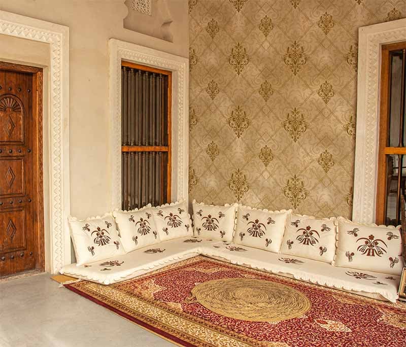 Sovereign Gold Elegance Damask Wallpaper Mural shown in a room