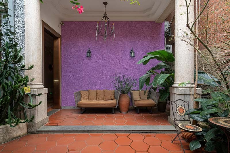 Purple Textured Wall Effect Wallpaper Mural shown in a room
