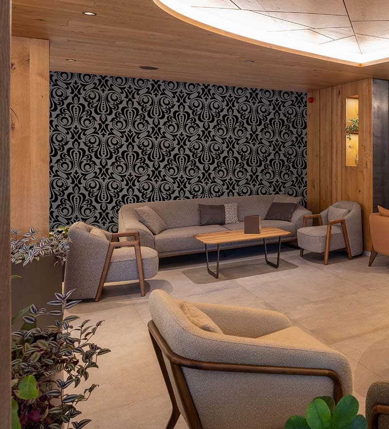 Dark Black Gray Baroque Style Wallpaper Mural shown in a room