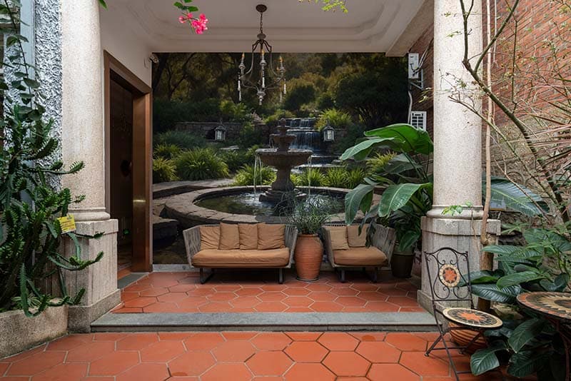 Serene Glen Fountain Wallpaper Mural shown in a room