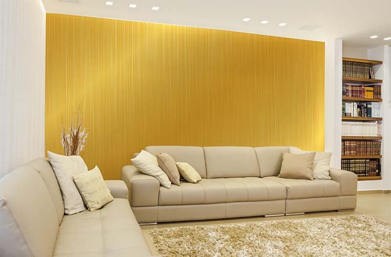 Glimmer Gold Metal Texture Wallpaper Mural shown in a room