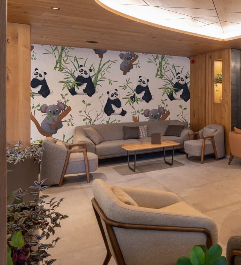 Cute Koalas and Pandas Animal Pattern Kids Room Wallpaper shown in a room
