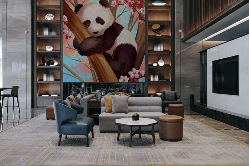 Panda Climbing A Tree Wallpaper Mural shown in a room