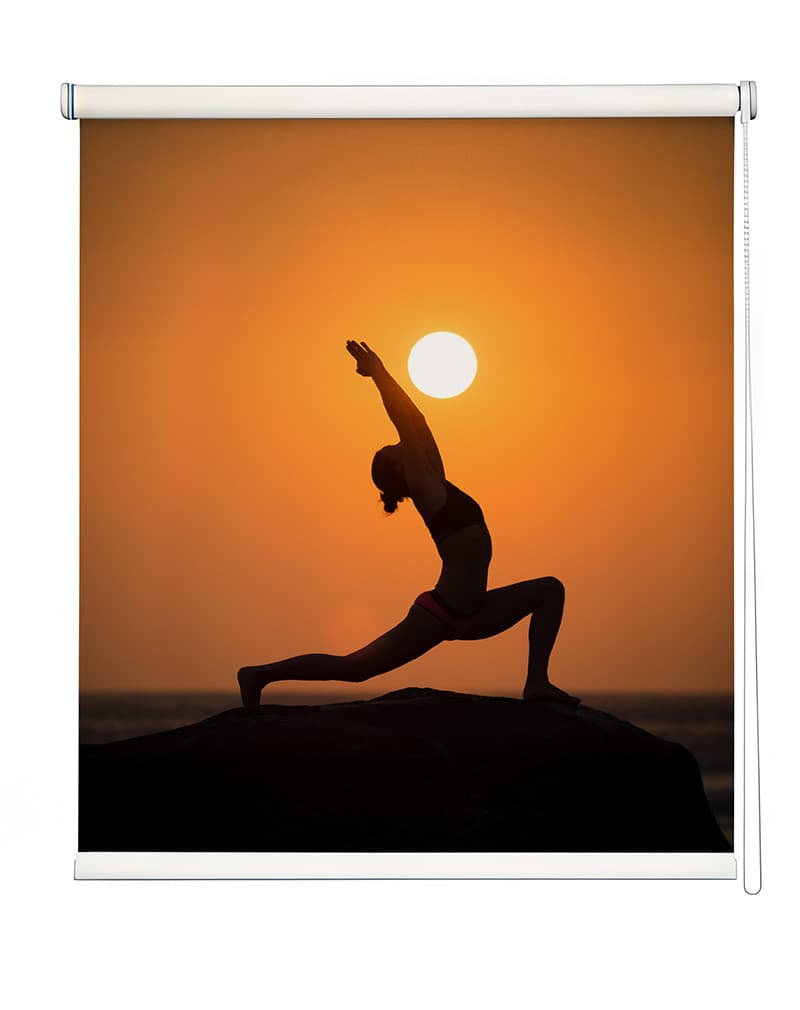 Sunset Yoga Art Window Roller Blind shown in a room