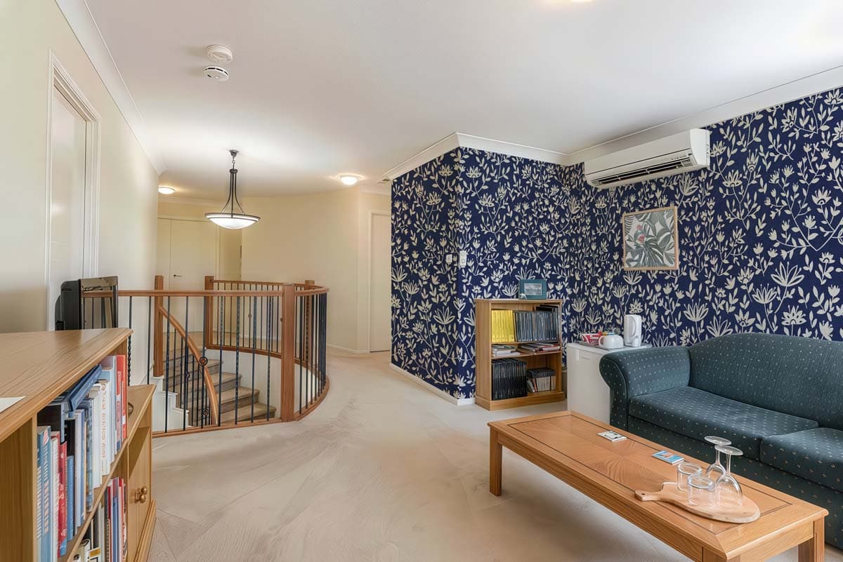 Lunar Bloom, Folk Floral Wallpaper shown in a room
